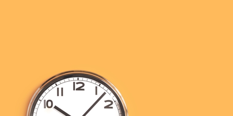 One big wall clock top part on orange background