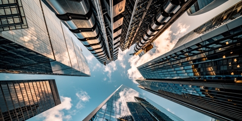 Looking directly up at the skyline of commercial building