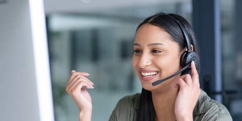 Dispatcher taking a phone call and dispatching the job