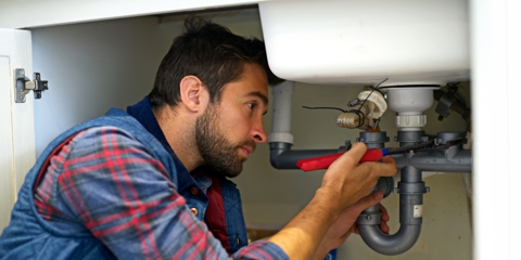 Plumber Fixing Sink