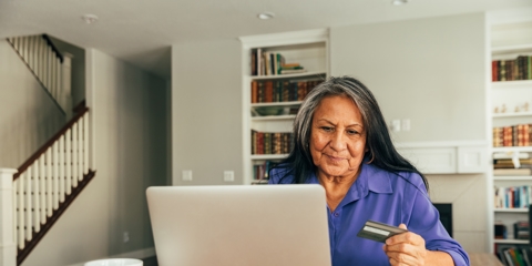 Senior Woman Paying Bills Online