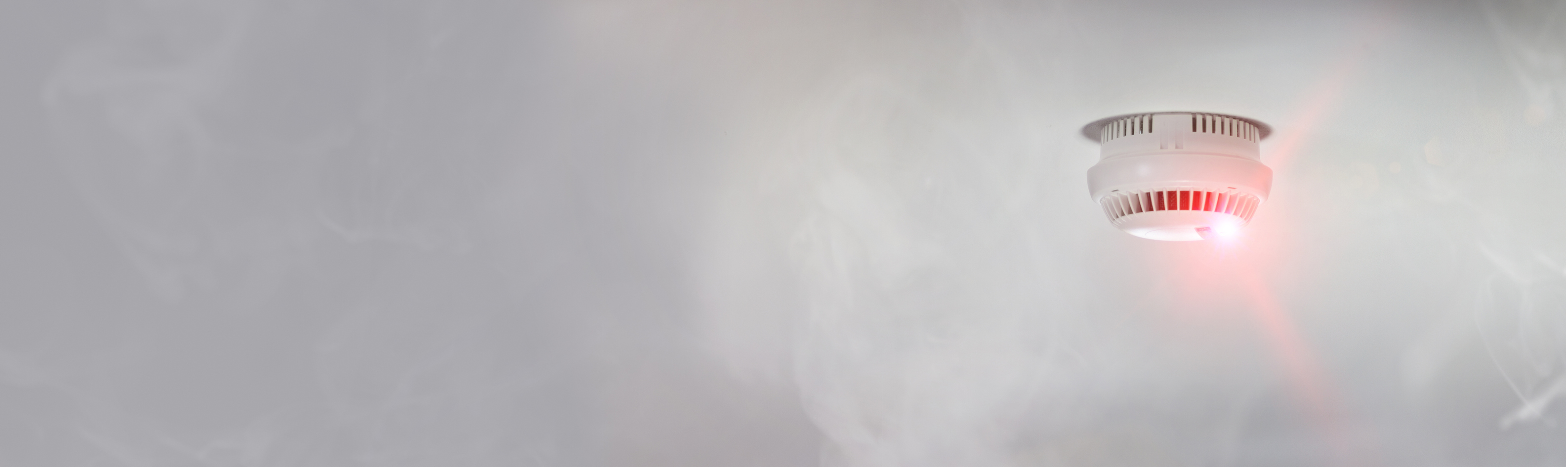 Smoke detector alert mounted on roof in home