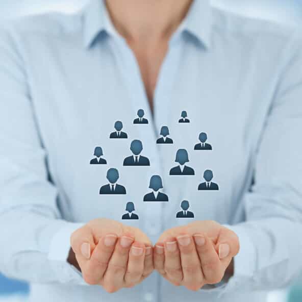 Marketing segmentation. Gathering/holding gesture of businesswoman, icons representing a group of people .