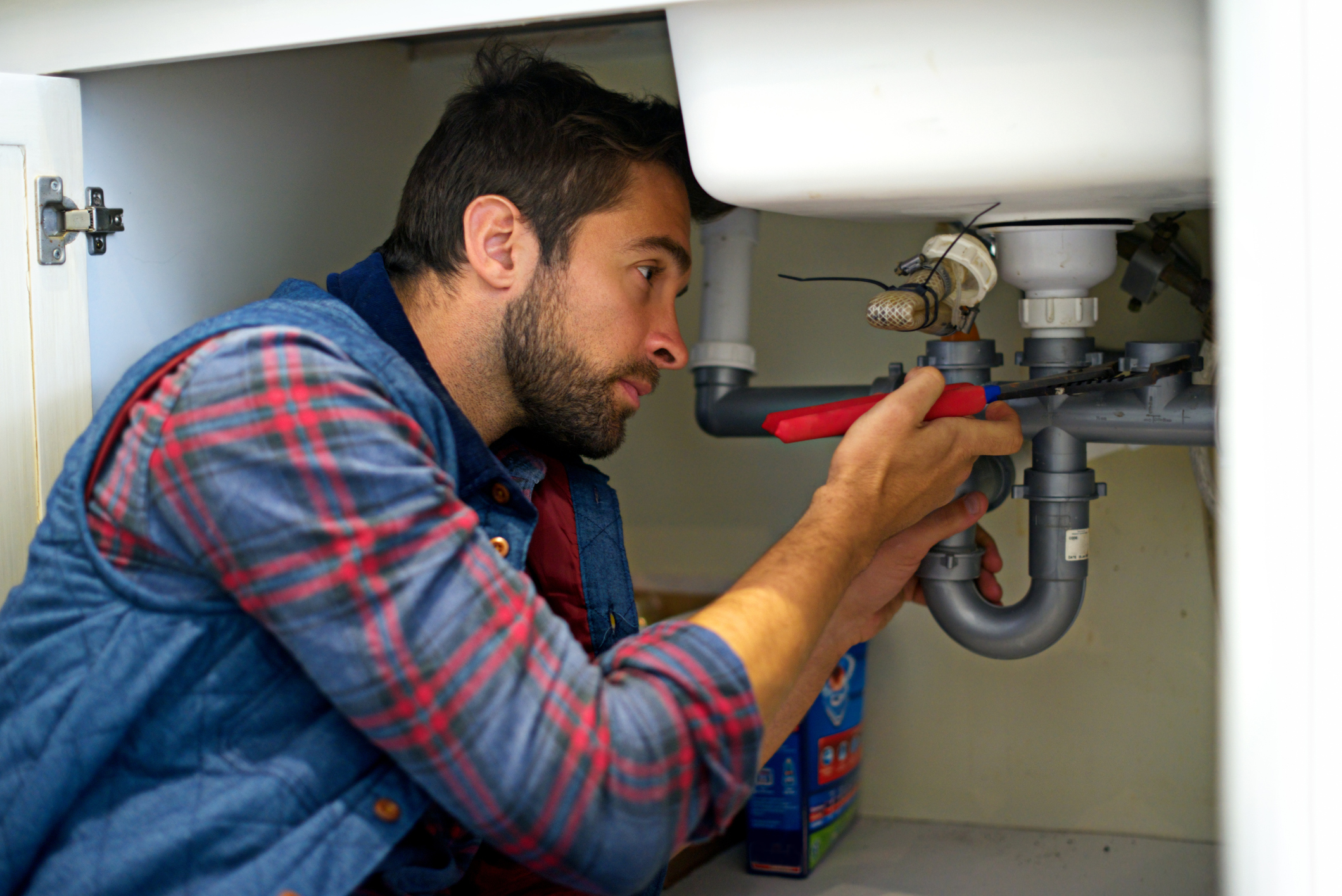 Plumber Fixing Sink